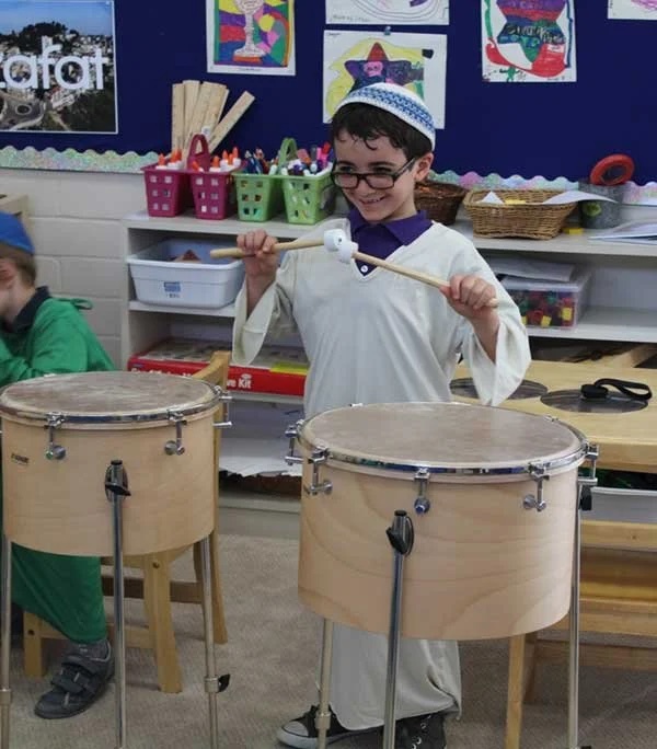 IHDS student enjoying a music class